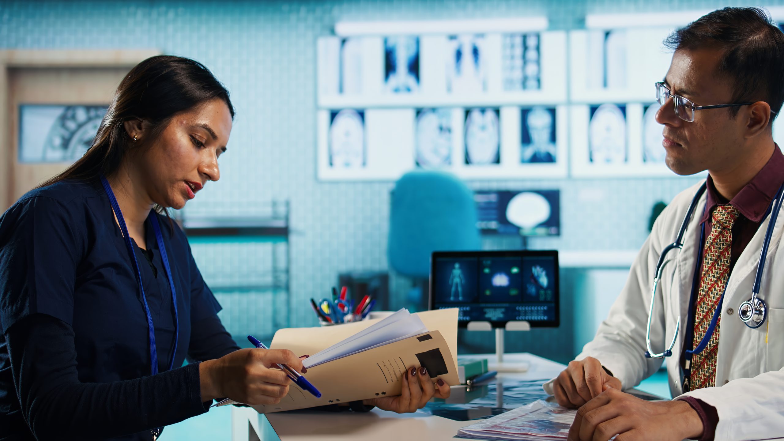 General practitioner consulting patient and reviewing x ray test results