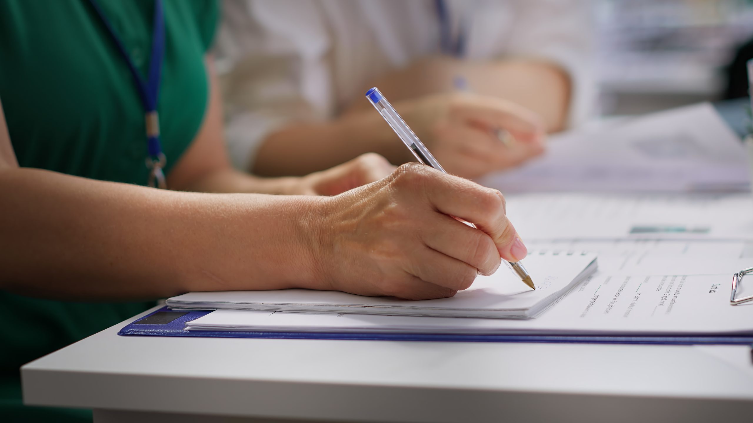 HR recruiters interviewing a job seeker and taking notes during meeting